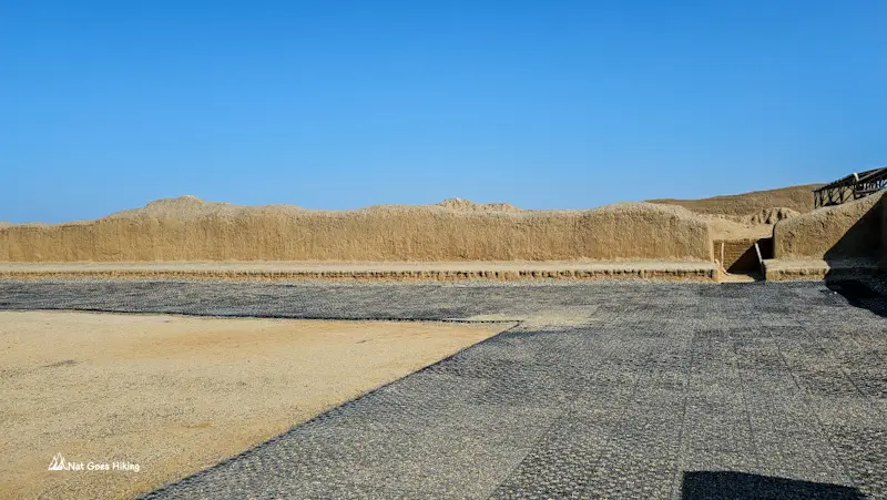 pen plaza with high adobe walls at Chan Chan, Peru