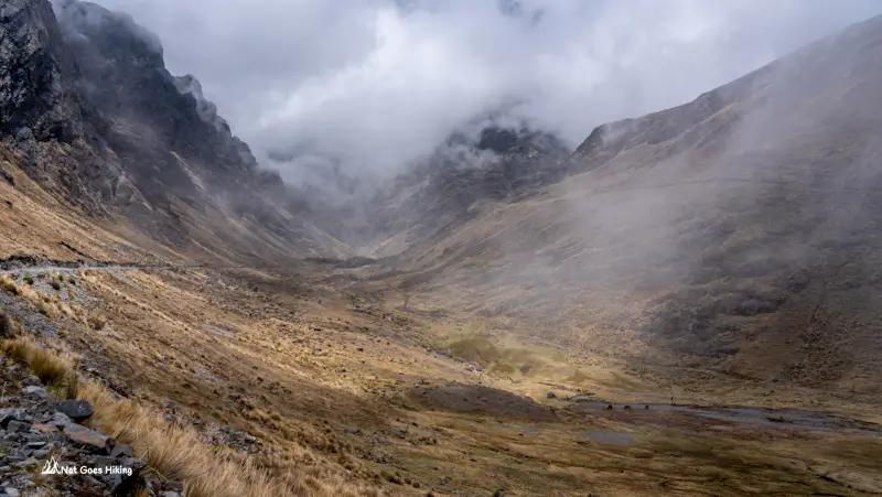 Andean valley and misty slopes vanishing into cloud on day1 of El Choro Trek